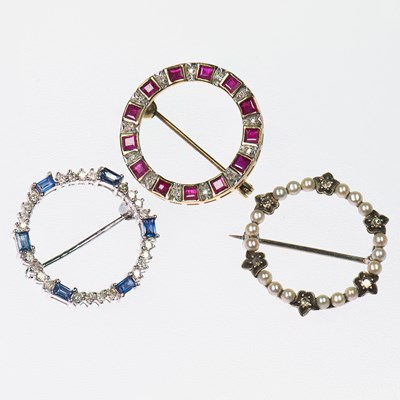 Lot 450 - THREE GEM-SET HOOP BROOCHES