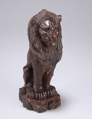 Lot 62 - A LATE VICTORIAN OAK MODEL OF A LION