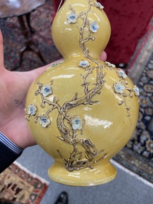 Lot 126 - A CHINESE MUSTARD-GLAZED WALL POCKET