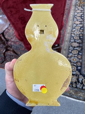 Lot 126 - A CHINESE MUSTARD-GLAZED WALL POCKET