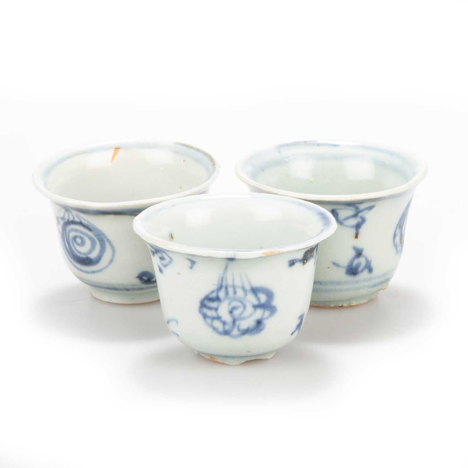 Lot 115 - THREE SMALL CHINESE BLUE AND WHITE BUDDHIST SYMBOLS WINE CUPS, MING 15TH CENTURY