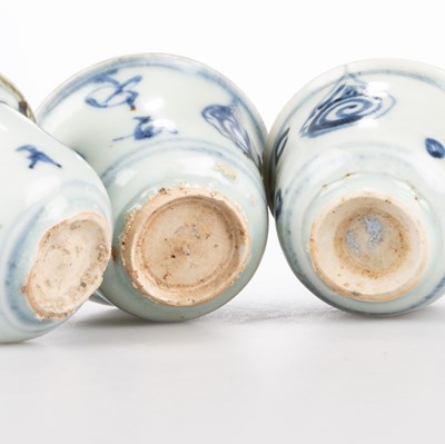 Lot 115 - THREE SMALL CHINESE BLUE AND WHITE BUDDHIST SYMBOLS WINE CUPS, MING 15TH CENTURY