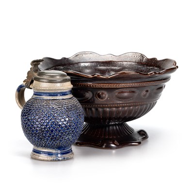 Lot 55 - A WESTERWALD GLOBULAR STONEWARE JUG WITH A PEWTER LID,  17TH CENTURY