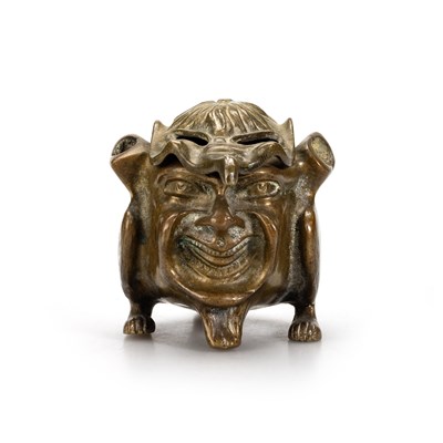 Lot 570 - A BRASS INKWELL IN THE FORM OF A GROTESQUE DEVIL OR IMP, CIRCA 1890-1900
