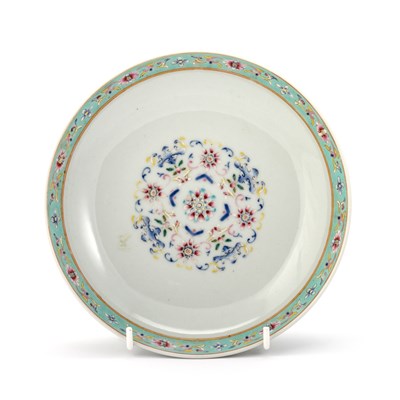 Lot 124 - A CHINESE CELADON-BACK FAMILLE ROSE DISH