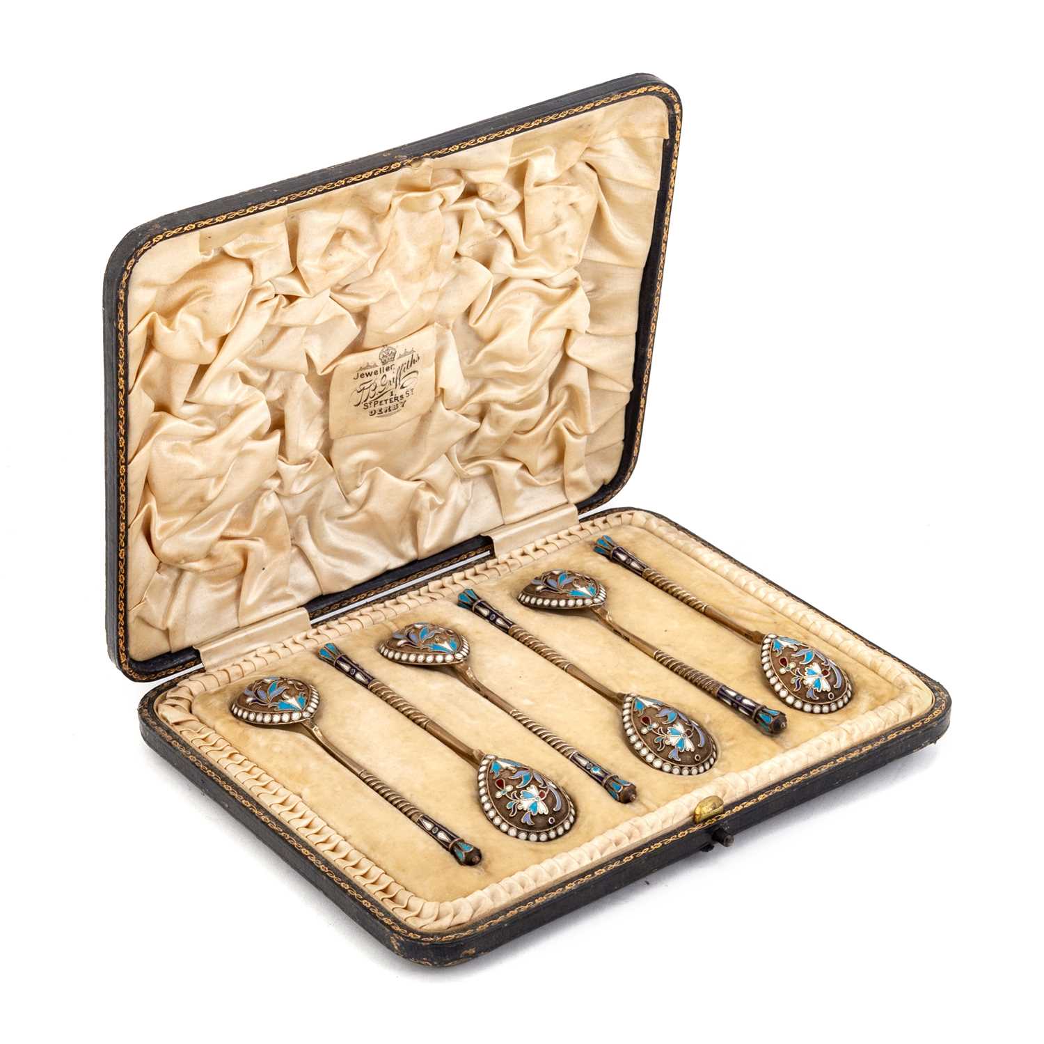 Lot 334 - A SET OF SIX RUSSIAN SILVER-GILT AND ENAMEL SPOONS