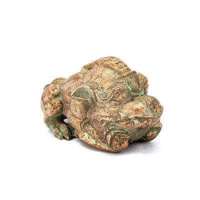 Lot 214 - A CHINESE GILT-BRONZE BIXIE