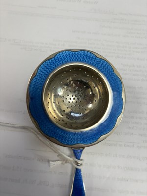 Lot 339 - A NORWEGIAN SILVER AND ENAMEL TEA STRAINER