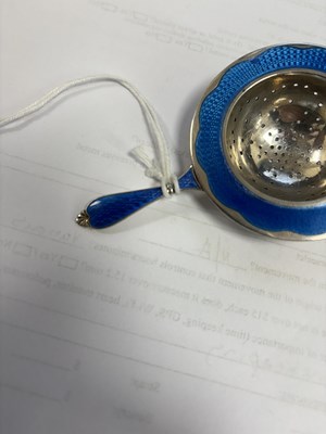 Lot 339 - A NORWEGIAN SILVER AND ENAMEL TEA STRAINER