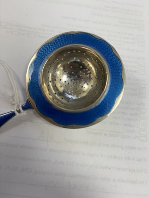 Lot 339 - A NORWEGIAN SILVER AND ENAMEL TEA STRAINER
