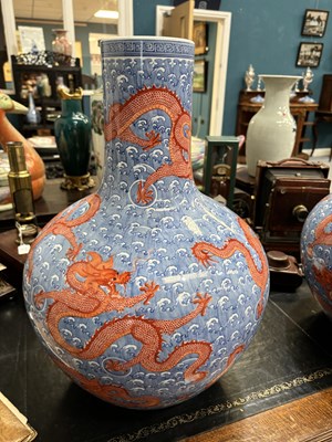 Lot 100 - A LARGE PAIR OF CHINESE UNDERGLAZE BLUE AND IRON-RED DRAGON VASES, TIANQIUPING