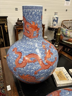 Lot 100 - A LARGE PAIR OF CHINESE UNDERGLAZE BLUE AND IRON-RED DRAGON VASES, TIANQIUPING
