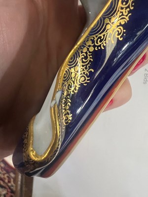 Lot 73 - A PAIR OF MEISSEN BLUE-GROUND MODELS OF SLIPPERS
