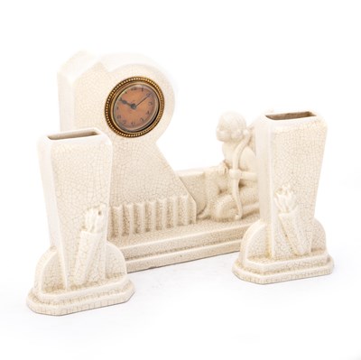 Lot 63 - AN ART DECO CRACKLE-GLAZED CLOCK GARNITURE