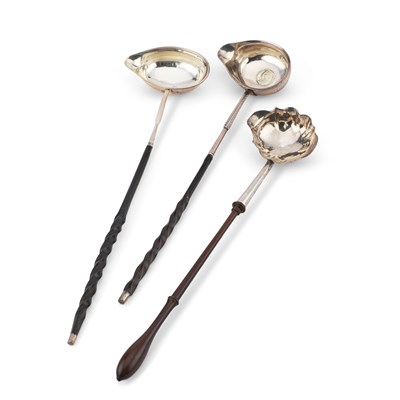 Lot 234 - THREE GEORGIAN SILVER TODDY LADLES