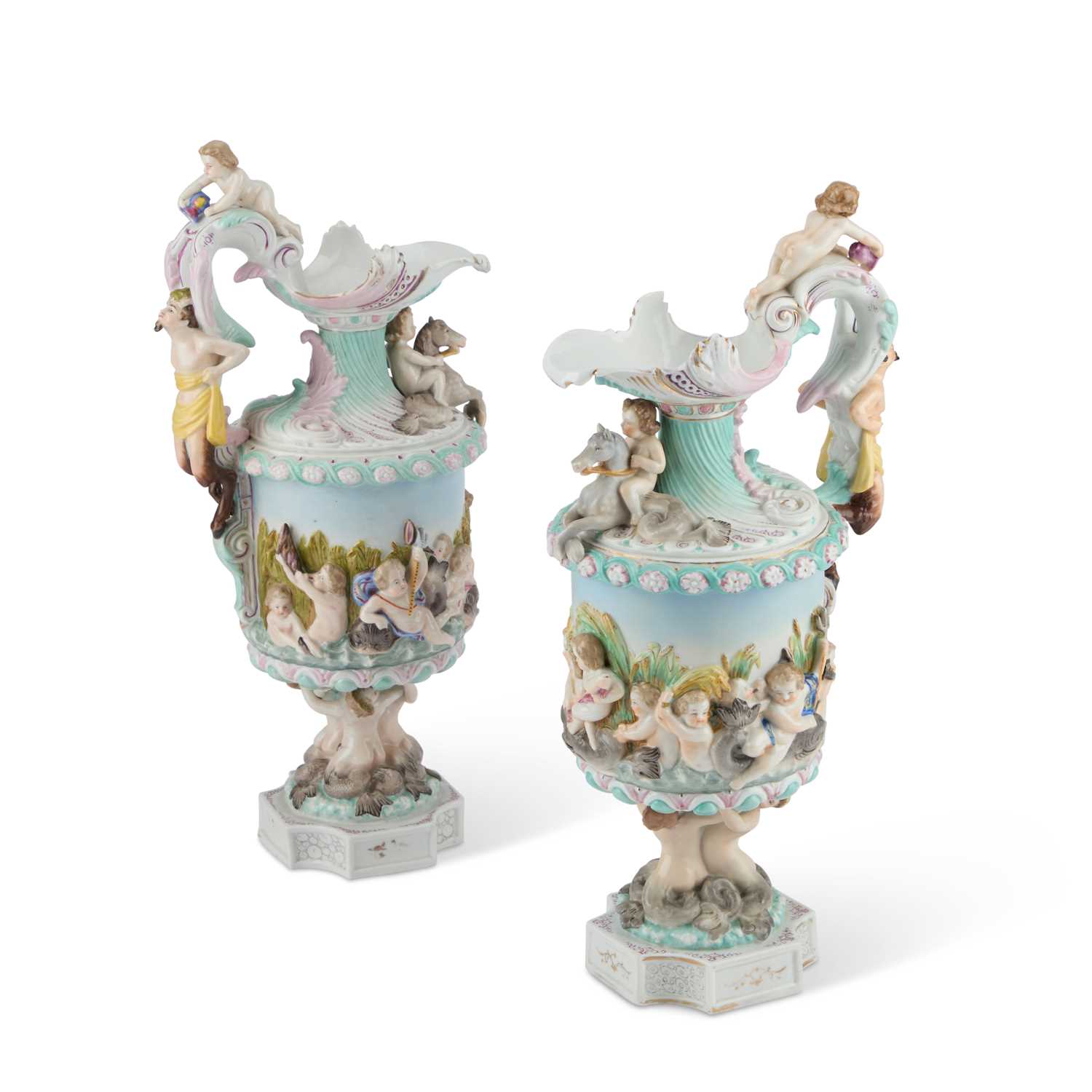 Lot 61 - A NEAR PAIR OF GERMAN PORCELAIN EWERS, CIRCA 1900