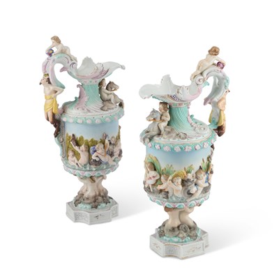 Lot 61 - A NEAR PAIR OF GERMAN PORCELAIN EWERS, CIRCA 1900