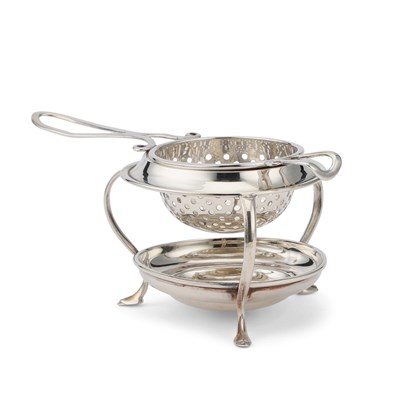 Lot 453 - A GEORGE V SILVER TEA STRAINER