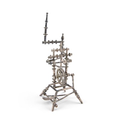Lot 302 - A CONTINENTAL SILVER MINIATURE MODEL OF A SPINNING WHEEL