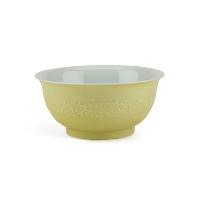 Lot 636 - A CHINESE MOULDED YELLOW-BACKED FAMILLE ROSE BOWL