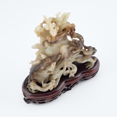 Lot 114 - A CHINESE BLACK AND WHITE JADE 'MYTHICAL BEAST' VASE AND COVER