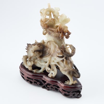 Lot 114 - A CHINESE BLACK AND WHITE JADE 'MYTHICAL BEAST' VASE AND COVER