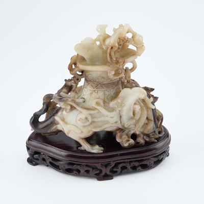 Lot 114 - A CHINESE BLACK AND WHITE JADE 'MYTHICAL BEAST' VASE AND COVER