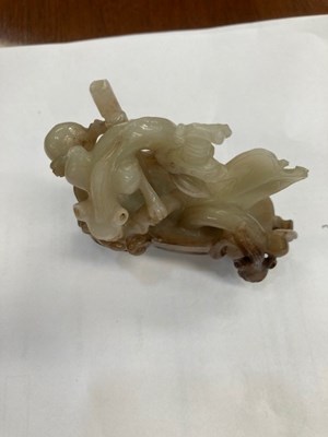 Lot 114 - A CHINESE BLACK AND WHITE JADE 'MYTHICAL BEAST' VASE AND COVER
