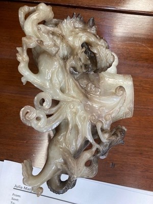 Lot 114 - A CHINESE BLACK AND WHITE JADE 'MYTHICAL BEAST' VASE AND COVER