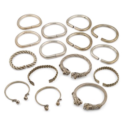 Lot 143 - A COLLECTION OF CHINESE WHITE METAL BANGLES