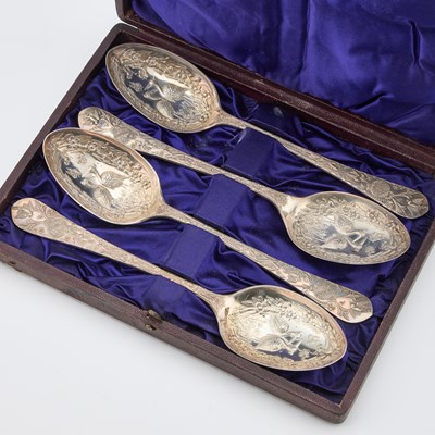Lot 136 - A SET OF FOUR ENGLISH AESTHETIC MOVEMENT SILVER-PLATED SERVING SPOONS
