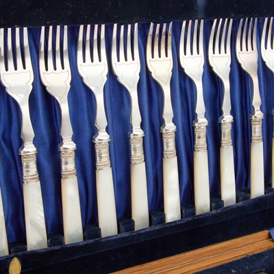 Lot 136 - A SET OF FOUR ENGLISH AESTHETIC MOVEMENT SILVER-PLATED SERVING SPOONS