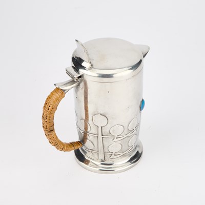 Lot 185 - ARCHIBALD KNOX (1864-1933) FOR LIBERTY & CO, A TUDRIC PEWTER AND ENAMEL HOT WATER JUG