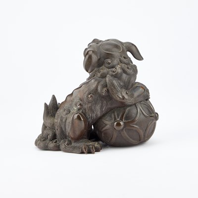 Lot 96 - A CHINESE BRONZE MODEL OF A BUDDHIST LION, 19TH CENTURY
