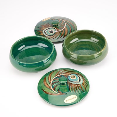 Lot 63 - A PAIR OF MOORCROFT POTTERY POWDER BOWLS AND COVERS, DESIGNED BY SALLY TUFFIN FOR LIBERTY & CO