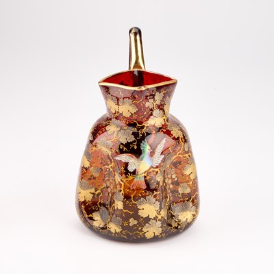 Lot 15 - A MOSER GILT AND ENAMELLED AMBERLINE GLASS PITCHER AND BEAKER, EARLY 20TH CENTURY