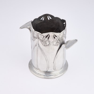 Lot 311 - ARCHIBALD KNOX (1864-1933) FOR LIBERTY & CO, A TUDRIC PEWTER BOTTLE STAND