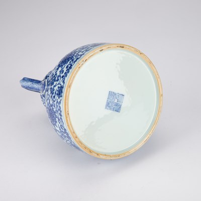 Lot 930 - A CHINESE BLUE AND WHITE DOUBLE-GOURD AND 'RUYI' HANDLED LOTUS FLASK