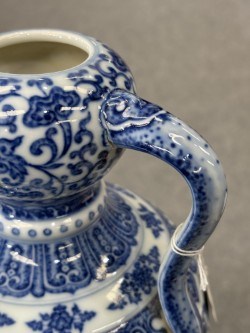 Lot 930 - A CHINESE BLUE AND WHITE DOUBLE-GOURD AND 'RUYI' HANDLED LOTUS FLASK