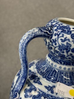 Lot 930 - A CHINESE BLUE AND WHITE DOUBLE-GOURD AND 'RUYI' HANDLED LOTUS FLASK