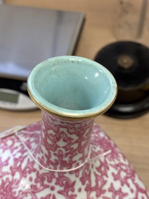Lot 63 - A CHINESE PUCE-DECORATED FAMILLE ROSE VASE