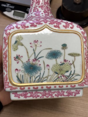 Lot 63 - A CHINESE PUCE-DECORATED FAMILLE ROSE VASE