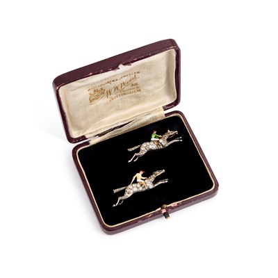 Lot 568 - A PAIR OF EARLY 20TH CENTURY DIAMOND AND ENAMEL JOCKEY BROOCHES