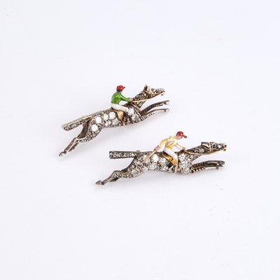 Lot 568 - A PAIR OF EARLY 20TH CENTURY DIAMOND AND ENAMEL JOCKEY BROOCHES