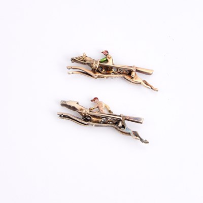 Lot 568 - A PAIR OF EARLY 20TH CENTURY DIAMOND AND ENAMEL JOCKEY BROOCHES