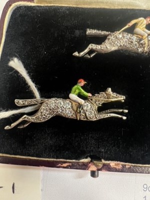 Lot 568 - A PAIR OF EARLY 20TH CENTURY DIAMOND AND ENAMEL JOCKEY BROOCHES