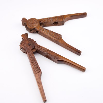 Lot 23 - TWO PAIRS OF 19TH CENTURY CARVED NUTCRACKERS