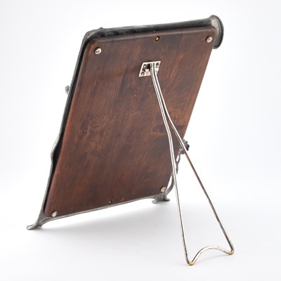 Lot 120 - WMF (WÜRTTEMBERGISCHE METALLWARENFABRIK), A LARGE ART NOUVEAU SILVERED METAL TABLE MIRROR