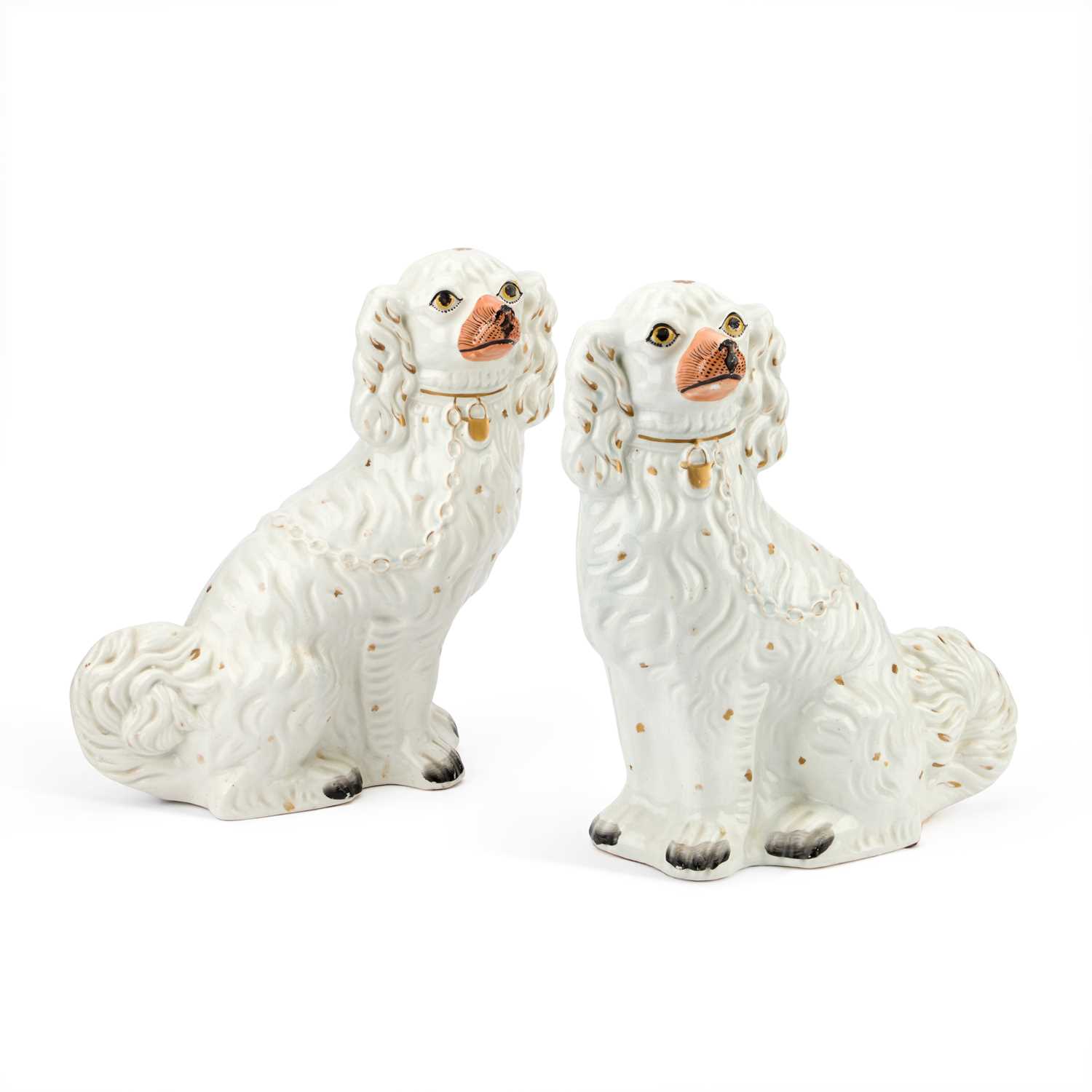Lot 35 - A PAIR OF VICTORIAN STAFFORDSHIRE POTTERY MODELS OF SEATED SPANIELS