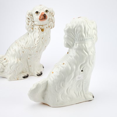 Lot 35 - A PAIR OF VICTORIAN STAFFORDSHIRE POTTERY MODELS OF SEATED SPANIELS